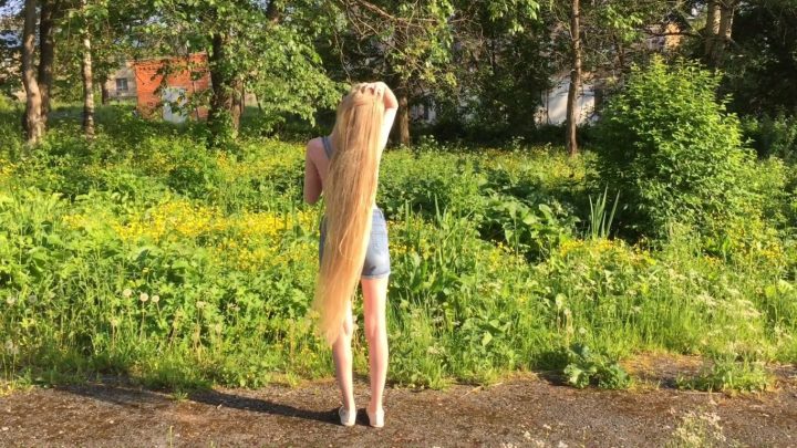 Kristina's Beautiful Hairplay in Nature with her Knee Length Blonde Tresses - Image 2