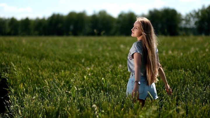 Beautiful Woman Playing With Hair in The Wind - Image 2